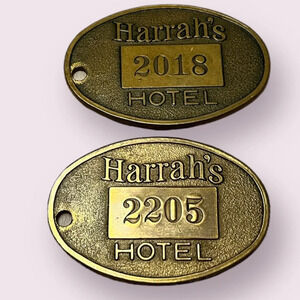 2  vintage hotel key fobs